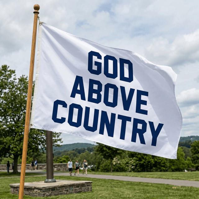 White flag reading GOD ABOVE COUNTRY on pole